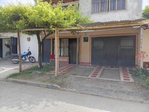 a house with a motorcycle parked in front of it at Ginebramagico in Ginebra