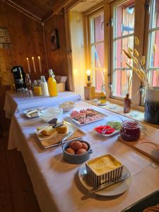 a table with eggs and other food on it at Kyrkjestølen B&B in Tyinkrysset +19 photos