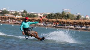 a man is water skiing in the water at Selena Bay Hotel Suites in Hurghada