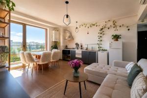a living room with a couch and a table at Dream Catchers LOFT in Bucharest