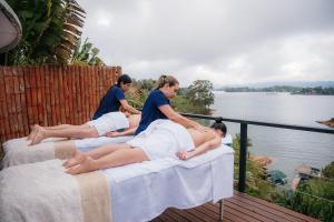 a group of women laying on beds on a deck at Bliss Sanctuary Vista - Glamping and Club in Guatapé