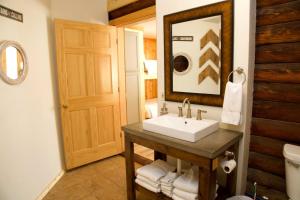 a bathroom with a sink and a mirror at Shell Campground in Shell +45 photos