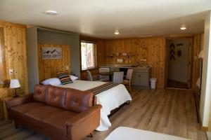 a bedroom with a bed and a couch at Shell Campground in Shell
