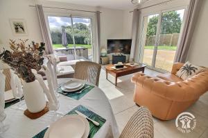 a living room with a couch and a table at Mathilde in Lannion