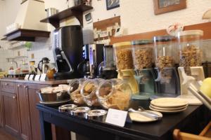 a counter in a kitchen with some food in jars at L'Ospitalità del Castello in Settimo Vittone
