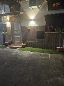 a front door of a house with potted plants at Corte26 in Nocera Inferiore