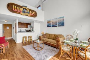 a living room with a couch and a table at Makani A Kai B11 in Wailuku