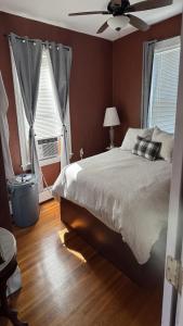a bedroom with a bed and a ceiling fan at Maggie S Place in Salem