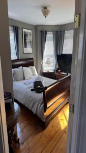 a bedroom with a large bed and a television at Maggie S Place in Salem +2 photos