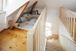 a staircase in a home with a playroom under the stairs at Historic Haven in Riga
