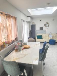 a living room with a white table and chairs at Hideaway Retreat 1 & 2 in Belvedere