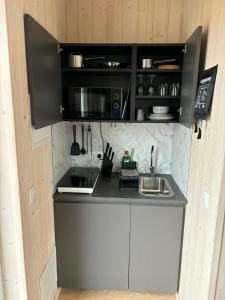 a small kitchen with a counter and a sink at Svala Guesthouses in Selfoss +16 photos
