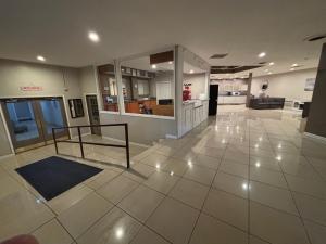 a large room with a kitchen and a living room at APM Inn & Suites in Martinsburg