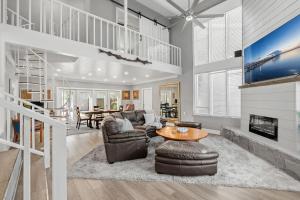 a living room with a couch and a table at 1055 Shady Lane in Merritt Island +61 photos