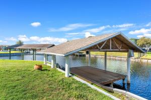 a pavilion on the side of a body of water at 1480 W Riviera Dr in Merritt Island