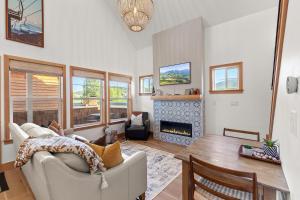 a living room with a couch and a fireplace at Stella del Mare in Dover ID in Dover