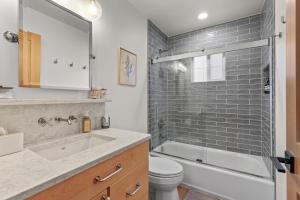 a bathroom with a tub and a toilet and a sink at Stella del Mare in Dover ID in Dover +27 photos