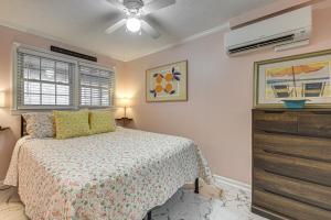 a bedroom with a bed and a ceiling fan at Steps to Beach! North Myrtle Beach (Cherry Grove) in Myrtle Beach +16 photos