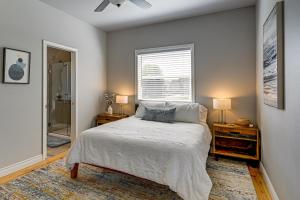 a bedroom with a bed with two night stands and a window at Hot Tub & Seasonal Pool: Remarkable Yakima Getaway in Yakima +31 photos