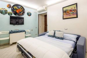 a hospital room with a bed and a tv at Sea 150mt - Il Vicolo di Cetara in Cetara