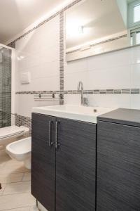 a bathroom with a sink and a toilet at Sea 150mt - Il Vicolo di Cetara in Cetara +12 photos