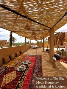 a covered patio with a table with food on it at The Guests Haven House - Heart Of Skoura in Skoura
