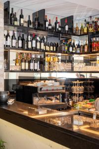 a bar with lots of bottles of wine at Hotel Porto A in Ulcinj