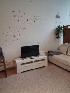 a living room with a flat screen tv on a wall at Apartamento Gabierrota in Rentería