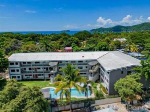 an aerial view of a building with a swimming pool at Paradizio in Coco