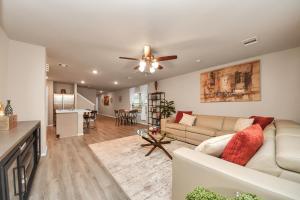 a living room with a couch and a ceiling fan at Modern Living, Close to Everything in Houston