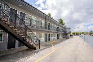 a building with a staircase on the side of it at Flamingo Motel near Universal Studios in North Hollywood