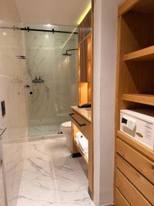 a bathroom with a shower and a toilet at Hacienda Peña Pobre in Mexico City +55 photos