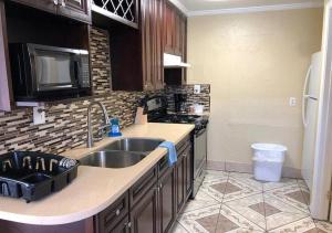 a kitchen with a sink and a stove at Jerry's Motel in Oakdale