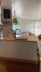 a kitchen with a wooden counter top in a room at Right Side in Greytown