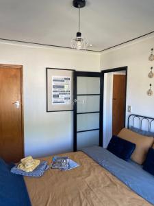 a bedroom with a bed with a tray on it at Right Side in Greytown +4 photos