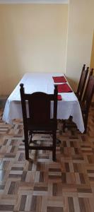 a bedroom with a table and two chairs in a room at Luz de la puna in La Quiaca