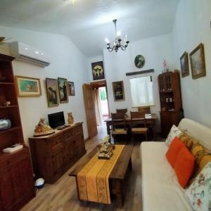 a living room with a couch and a table at Alborada in Pinos Genil