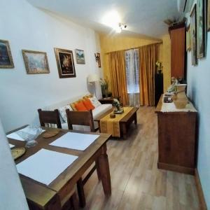 a living room with a couch and a table at Alborada in Pinos Genil