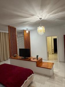 a bedroom with a desk with a computer on it at Villa Marsa in Dar el Haj Ahmed Souid