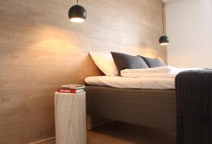 En eller flere senge i et værelse på Trudvang Apartment Hotel