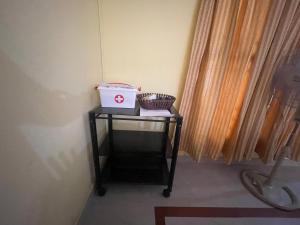 a small table with a box on it next to a window at D Cunhas Riviera in Cochin +31 photos