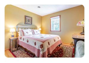 a bedroom with a bed and a window at Bourbon Roost in Saint Francis