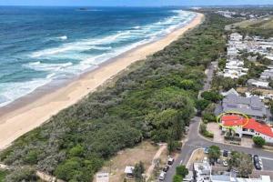 an aerial view of a beach and the ocean at Beachfront 1BR Loft. Surf-Café-Unwind in Marcoola