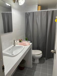 a bathroom with a sink and a toilet and a shower at Ally home 14 08 in Ban Bang Phang
