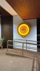 a yellow frisbee on the wall of a building at Ally home 14 08 in Ban Bang Phang
