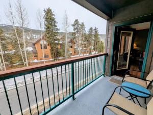 a balcony with chairs and a view of the mountains at Gateway Lodge 5030 by SummitCove Lodging in Colorado in Keystone
