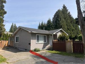 a small house with a fence and a driveway at Central Vally Private House in Abbotsford