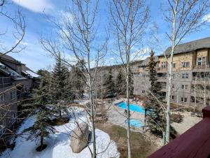 an aerial view of a building with a swimming pool at Expedition Station 8622 by SummitCove Lodging in Colorado in Keystone