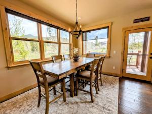 a dining room with a wooden table and chairs at Frey Gulch 58 by SummitCove Lodging in Colorado in Keystone +34 photos