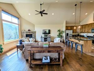 a living room with a couch and a table at Frey Gulch 58 by SummitCove Lodging in Colorado in Keystone